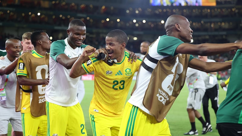 South Africa's Jayden Adams (23) dances with his teammates after a 1-0 win in the World Cup...