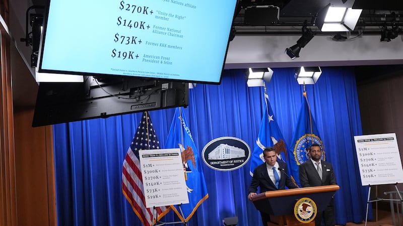 Acting Attorney General Todd Blanche speaks as FBI Director Kash Patel listens during a news...