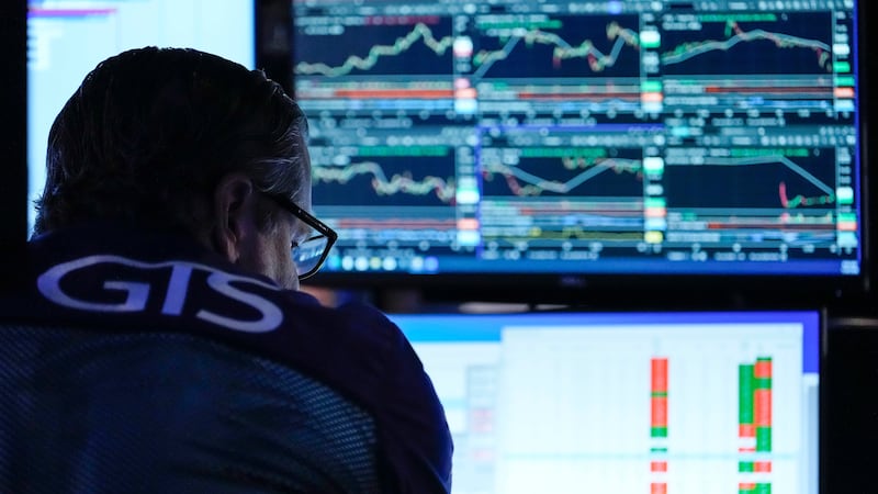 A trader works on the floor of the New York Stock Exchange, Thursday, July 30, 2026, in New York.