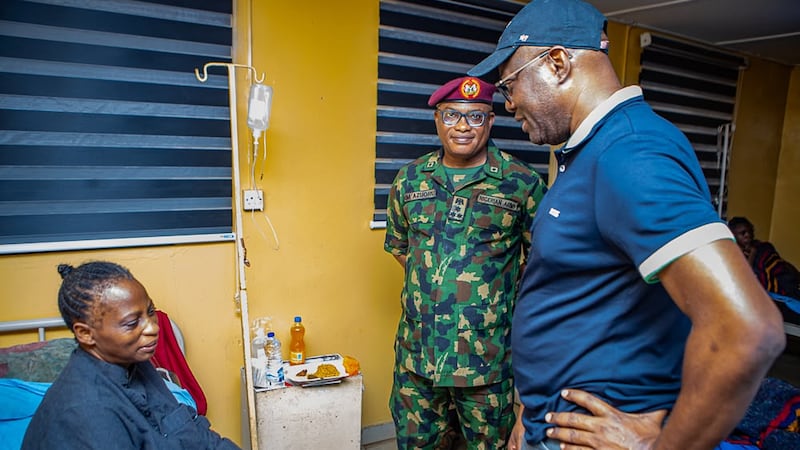 In this photo released by Oyo state government House, Governor Seyi Makinde, right, visits a...