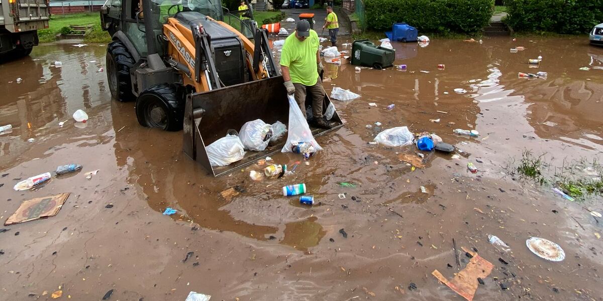 Garbage Flood Trash floats down Meriden street during flash flooding