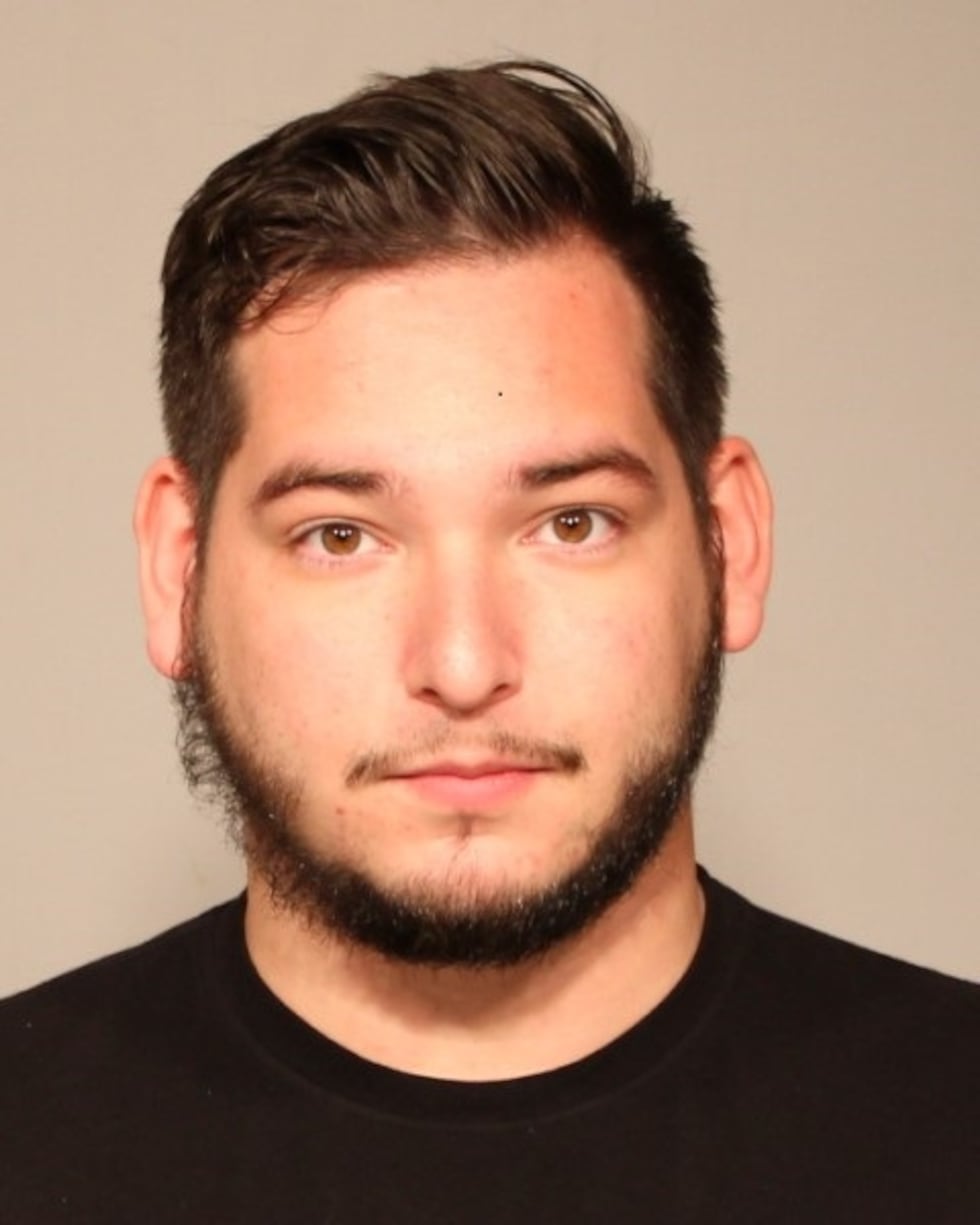 Jonathan Miller, a dispatcher, was arrested for misusing a police computer system in Meriden,...