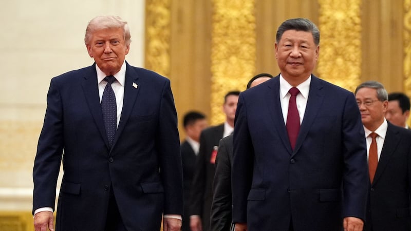 FILE - President Donald Trump, left, and Chinese President Xi Jinping arrive during a state...
