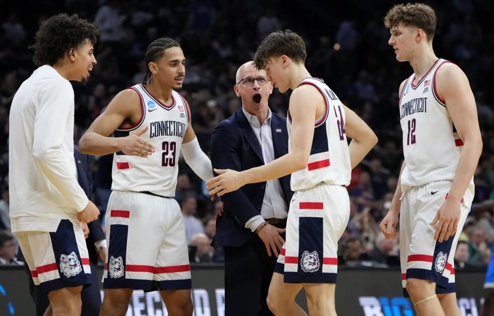 UConn's Dan Hurley celebrates with Braylon Mullins during the first half against UCLA in the...