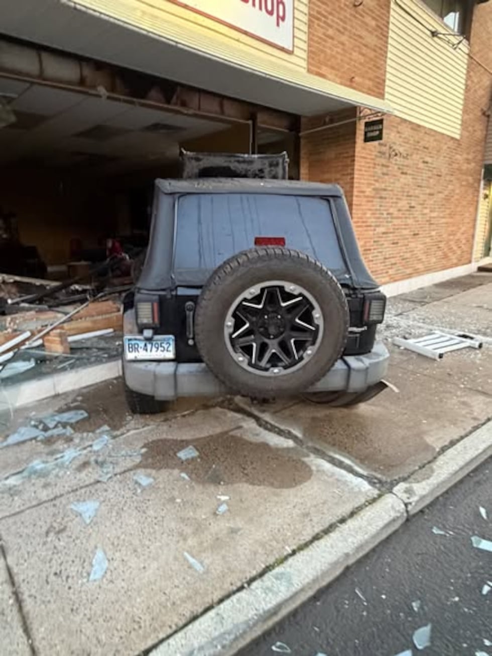 Police investigating after Hartford woman drives through barbershop