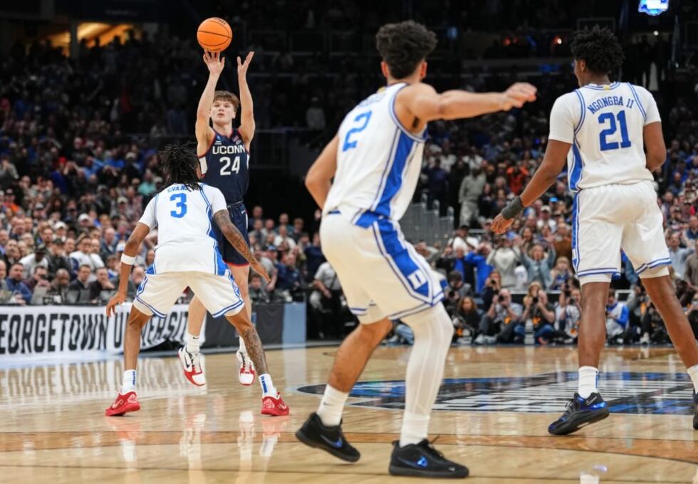UConn guard Braylon Mullins (24) scores the winning basket during the second half against Duke...