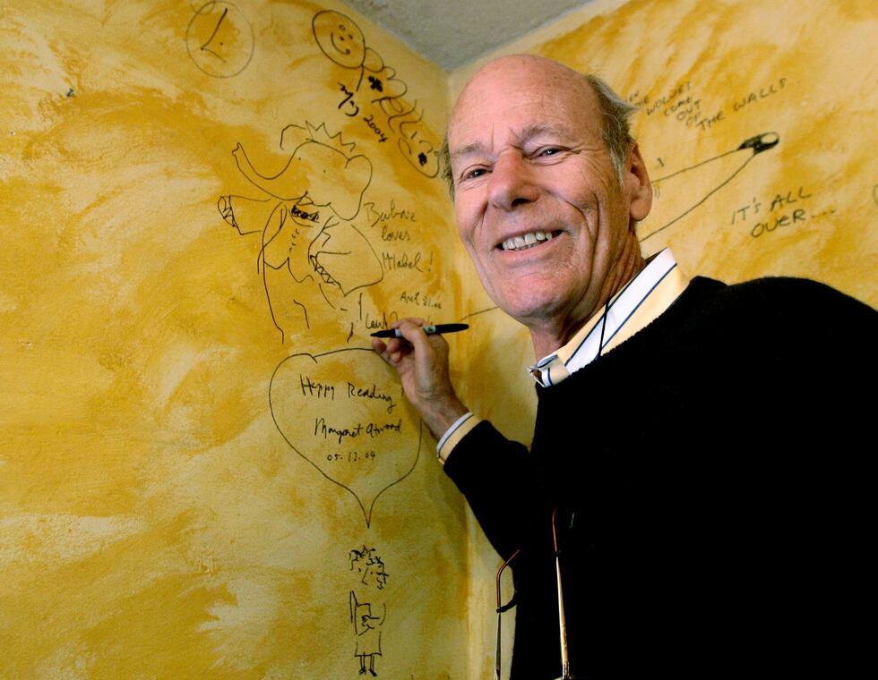 FILE - Babar author Laurent de Brunhoff signs the wall, while celebrating 75 years of the book...