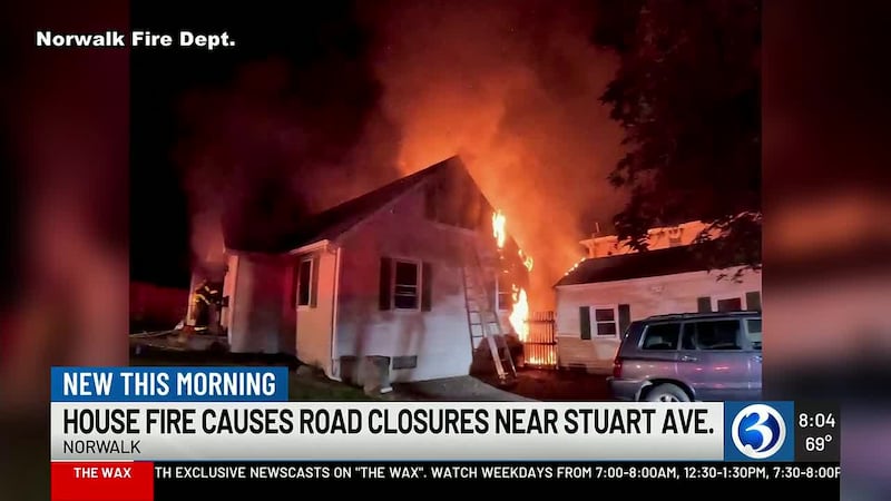 A third-alarm fire damaged a Norwalk home and spread to a detached garage on Saturday night.