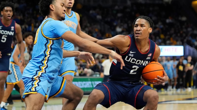 UConn's Silas Demary Jr. drives to the basket against Marquette's Adrien Stevens during the...
