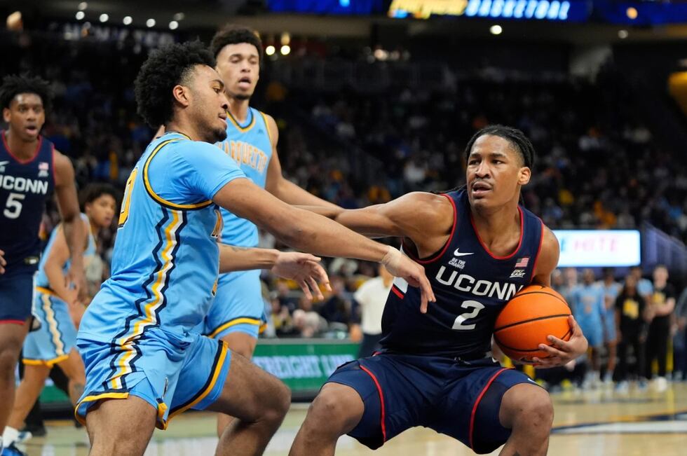 UConn's Silas Demary Jr. drives to the basket against Marquette's Adrien Stevens during the...