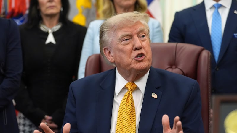 President Donald Trump speaks during a meeting about military families, in the Oval Office of...