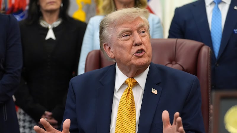 President Donald Trump speaks during a meeting about military families, in the Oval Office of...