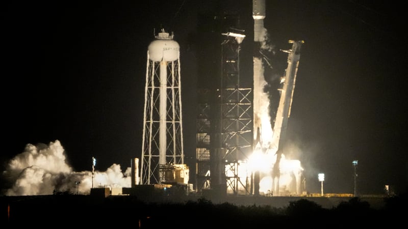 FILE - A SpaceX Falcon 9 rocket lifts off from pad 39A with a payload of a pair of lunar...