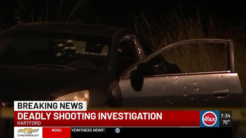 A victim was found dead inside a car that was riddled with bullets, according to police in...